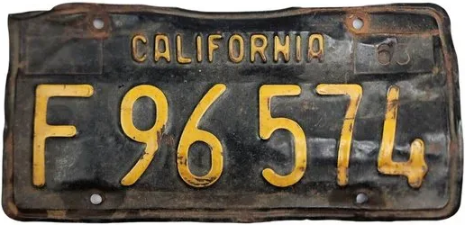 Black commercial plate with letter at the front