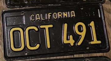 black passenger plate with rounded rectangle O, OCT 491