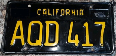 black passenger plate with rounded rectangle Q, AQD 417
